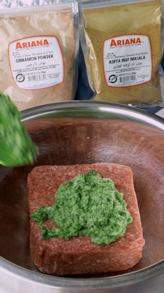 Start by placing an onion, cilantro and into a food processor, pulsing until finely chopped, and then pour this mixture over ground beef. 